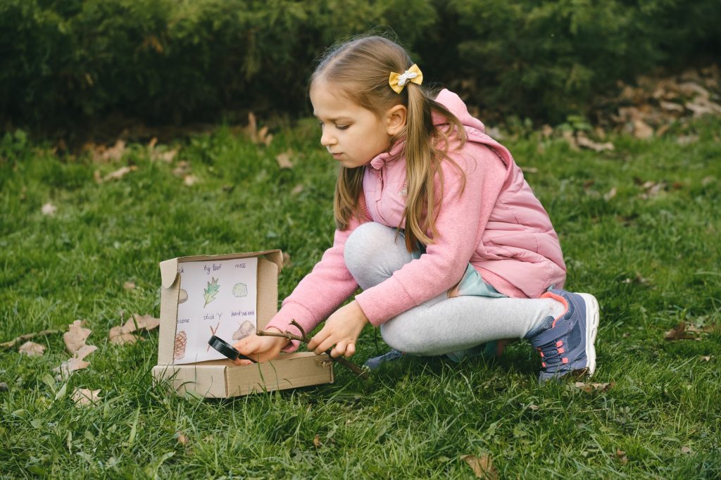 Nature education. Fun kids activity outdoors